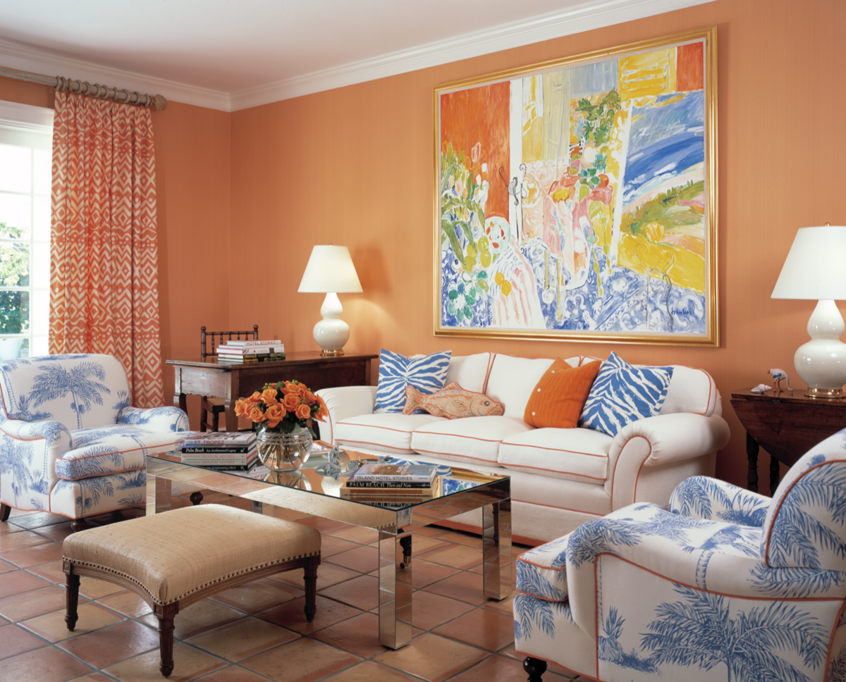 Цвета стен в интерьере гостиной. Персиковые стены. Гостиная в терракотовых тонах. Оранжевые стены в интерьере. Комната с оранжевыми стенами.