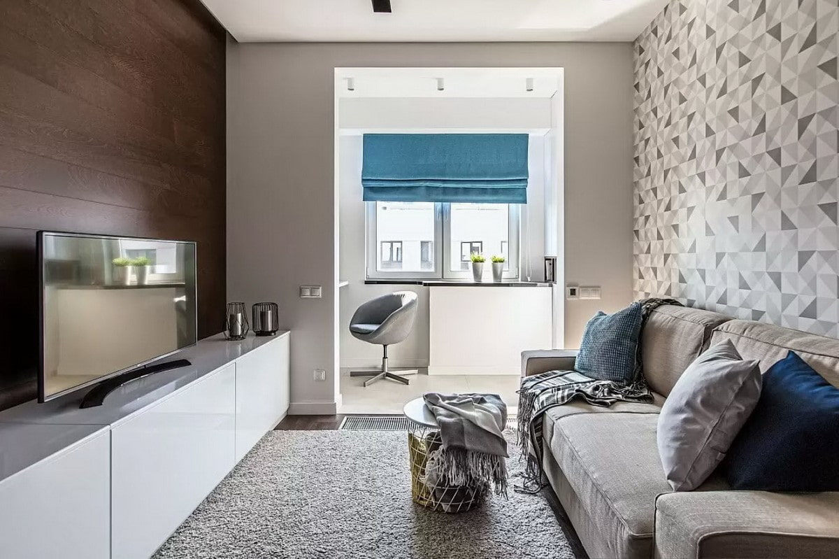 Интерьер однокомнатной квартиры 42 кв. кухня-гостиная с сапфировым диваном и элементами ар-деко